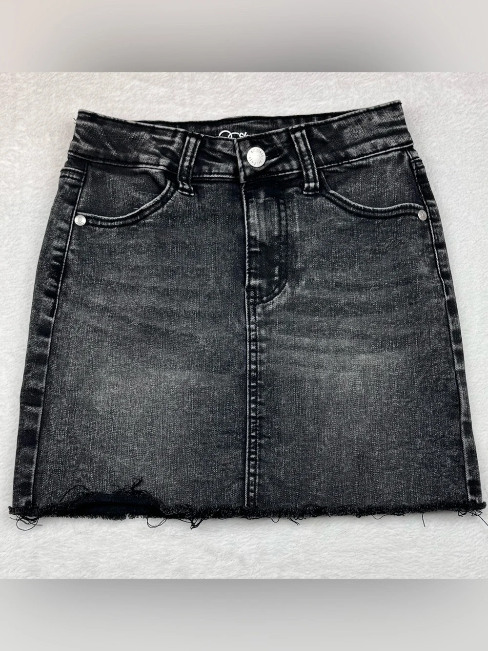 Lot of 2 girls denim skirts. The blue shirt is a size 8, black skirt is size 7/8